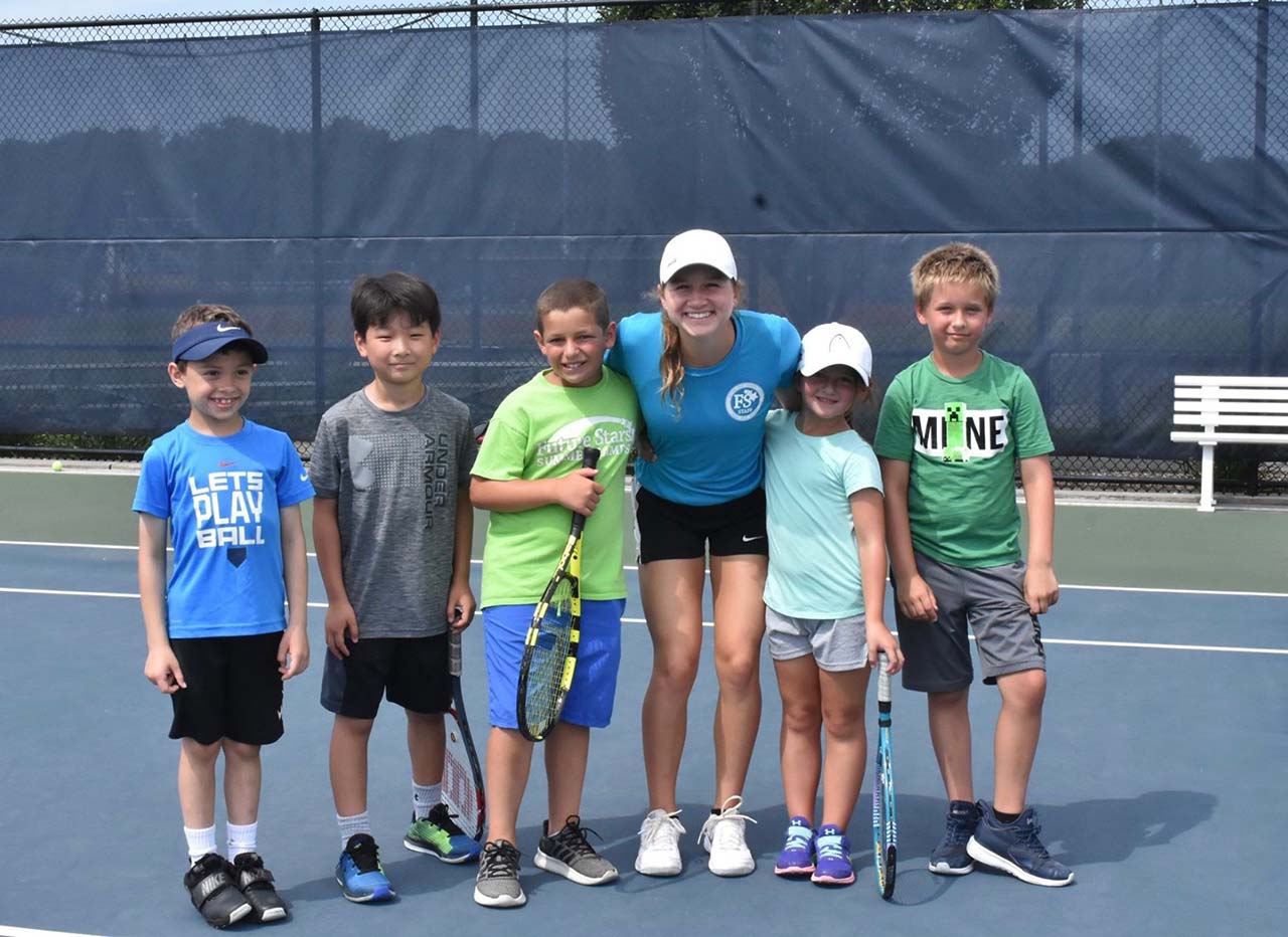 Tennis coach and campers group pic