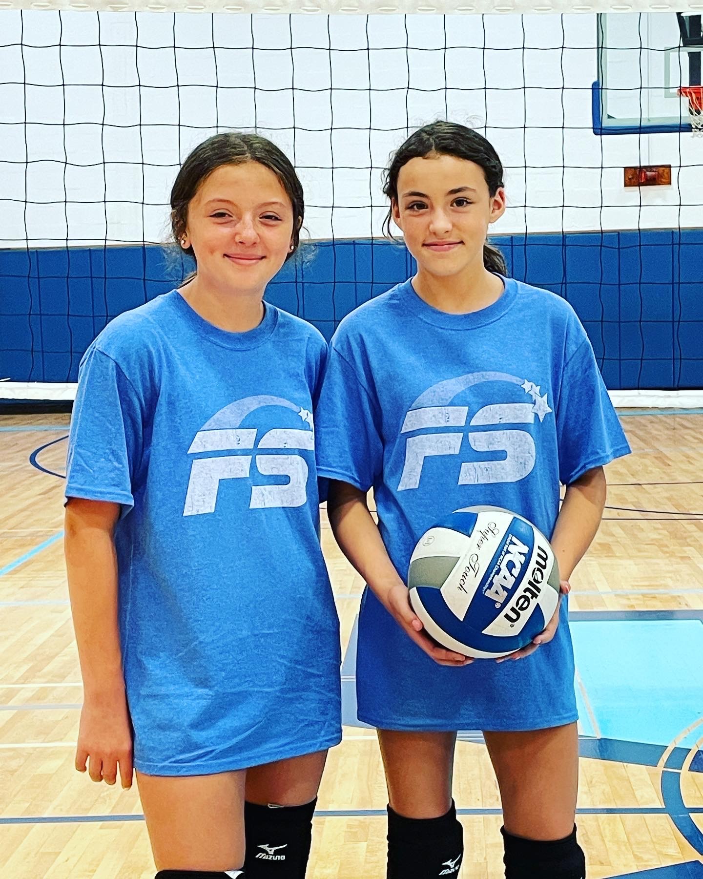 Syosset Volleyball campers smiling with ball