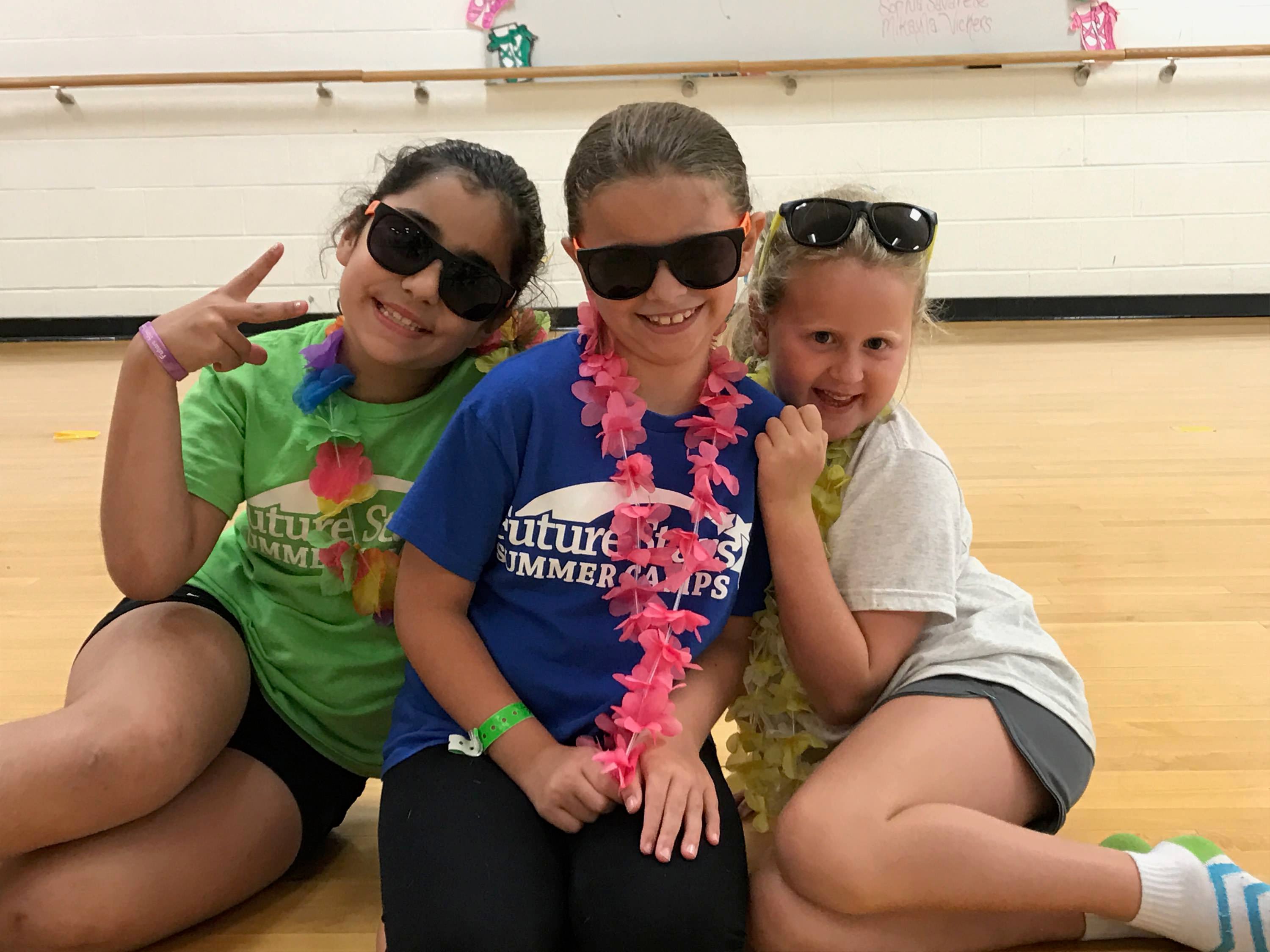 dance camp - small group of girls with glasses and smiling