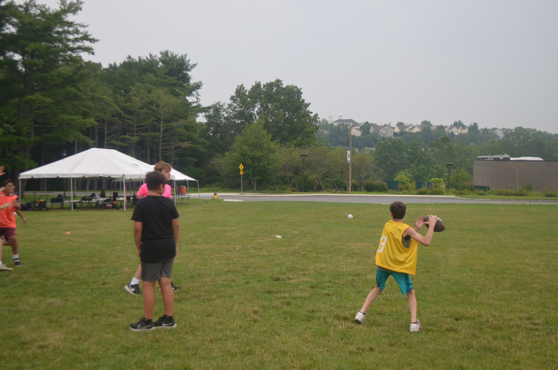 kids playing football in park